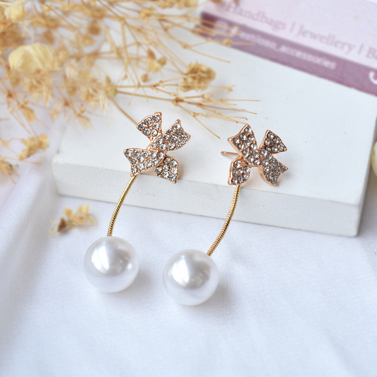 Studded butterfly pearl drop earrings